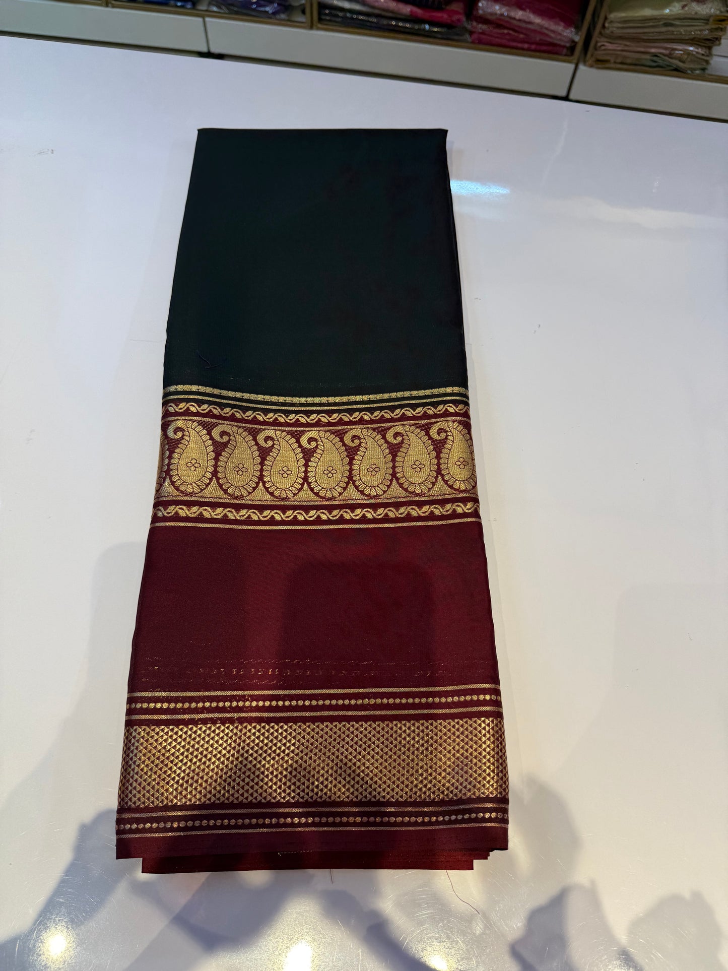 Black with marron semi crepe mango bentex border saree