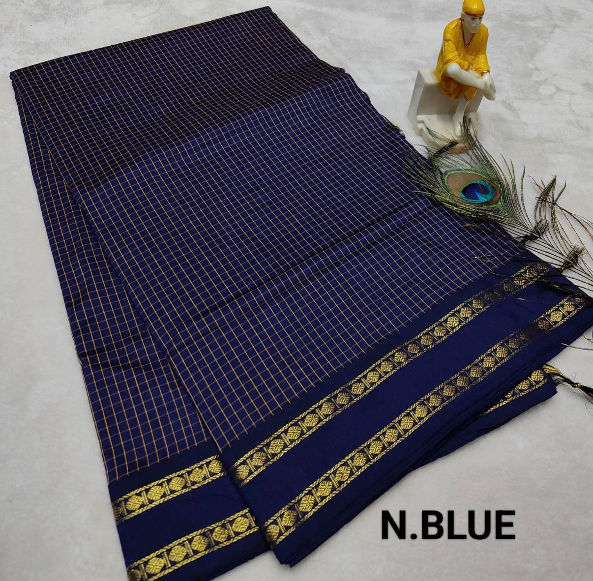 A gorgeous blue chequered cotton saree with a small blue border and a double rudraksham gold zari border(Navy blue)