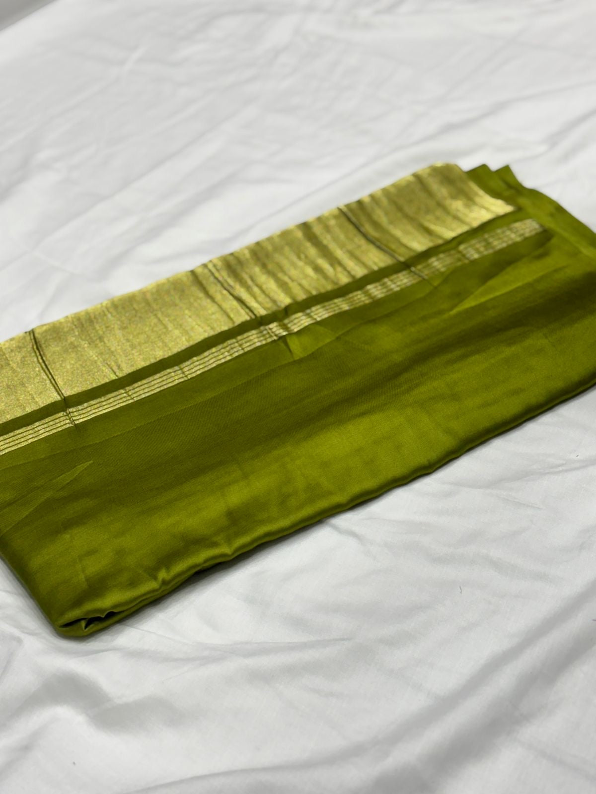 Parrot green pure plain modal silk saree with lagadi pallu