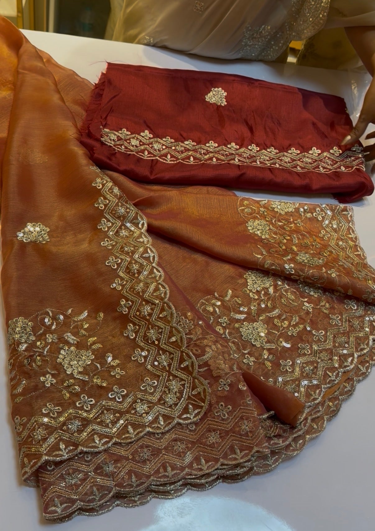Rust orange fluid organza saree