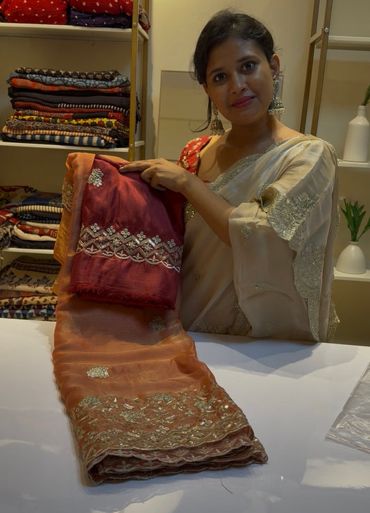 Rust orange fluid organza saree