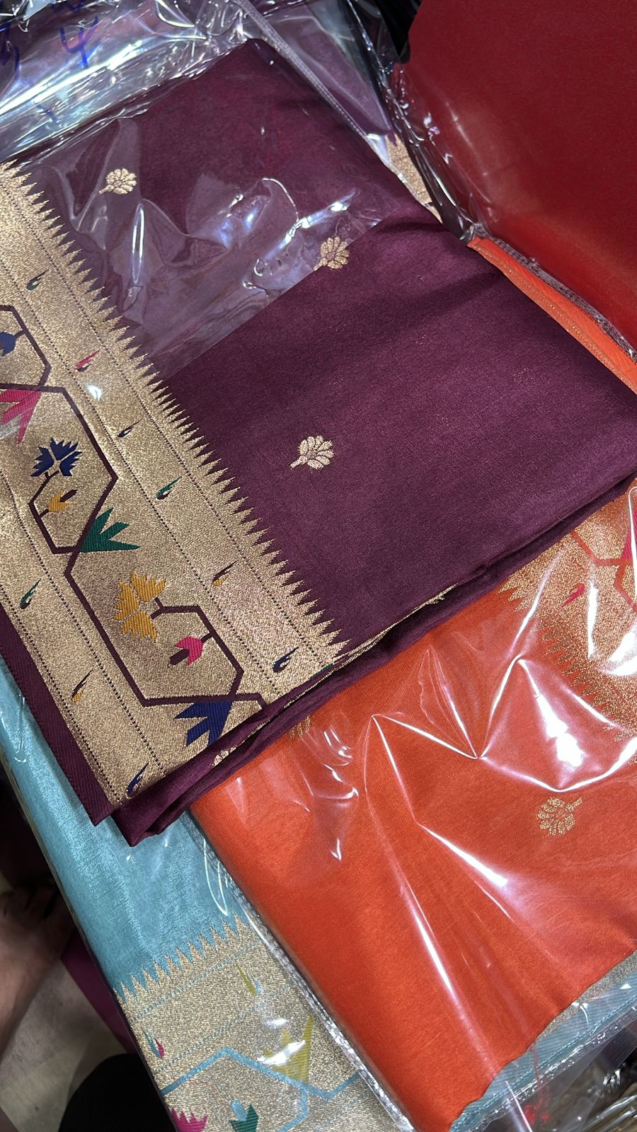 Wine dola silk saree with paithani border.
