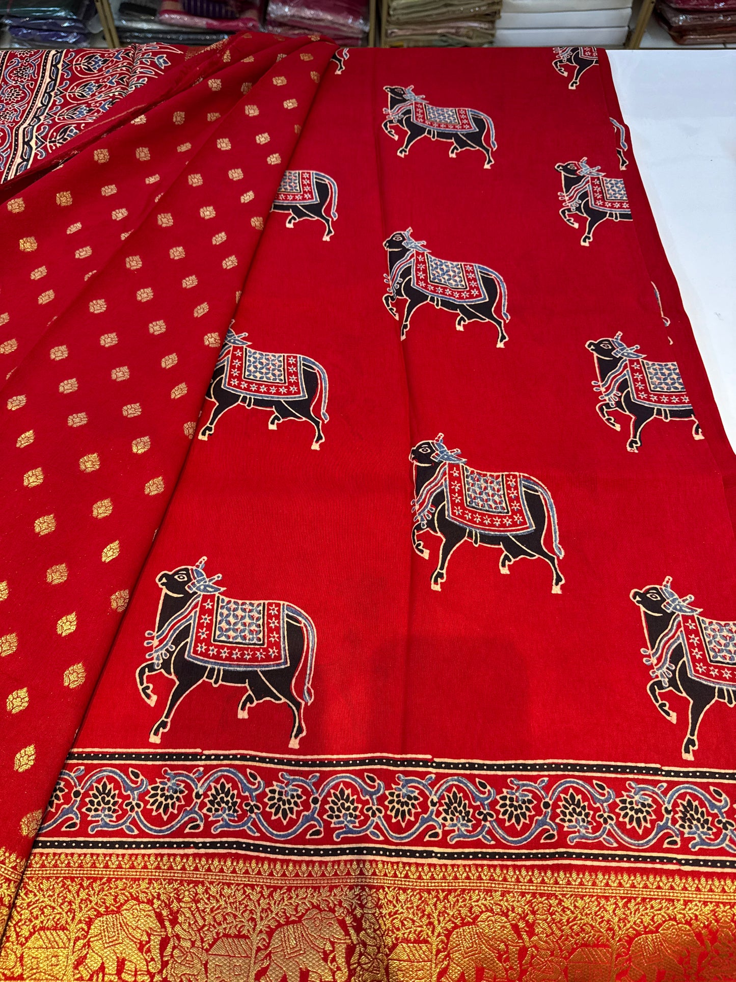 Cow design red Dola Silk Saree with ajrakh hand block print