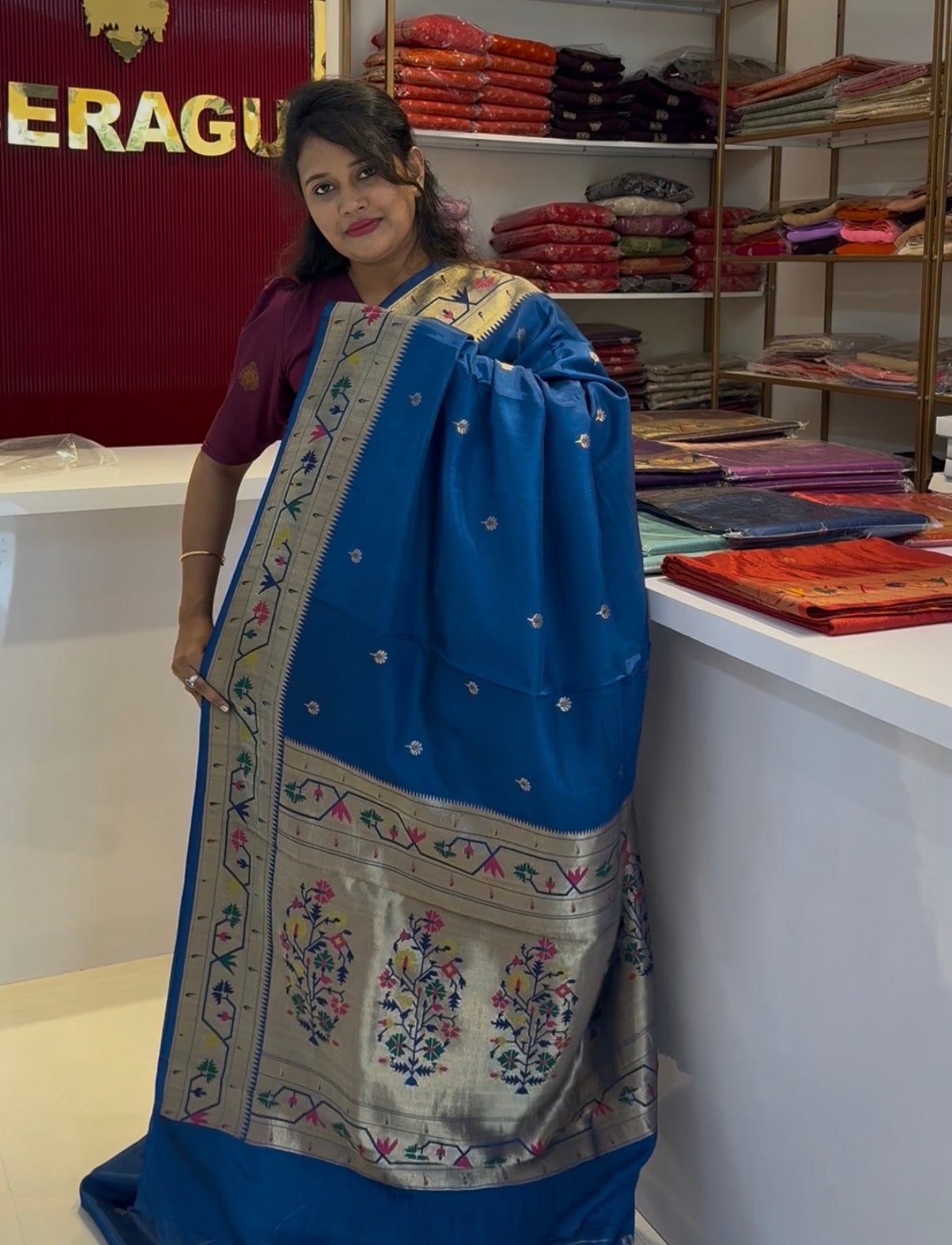 Teal blue dola silk saree with paithani border.