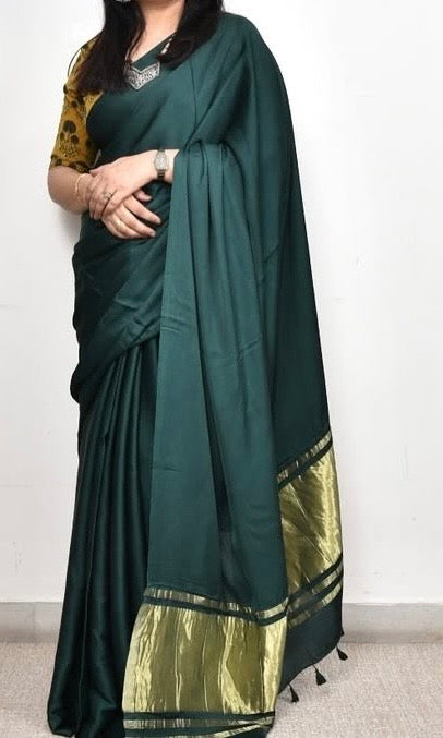 Green pure plain modal silk saree with lagadi pallu