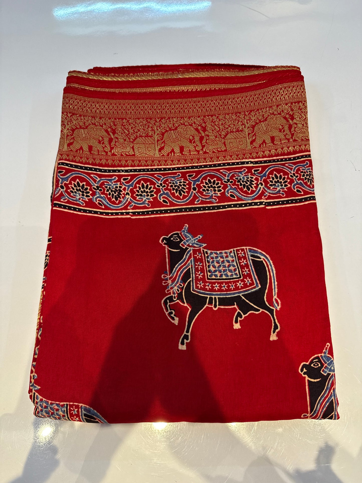 Cow design red Dola Silk Saree with ajrakh hand block print