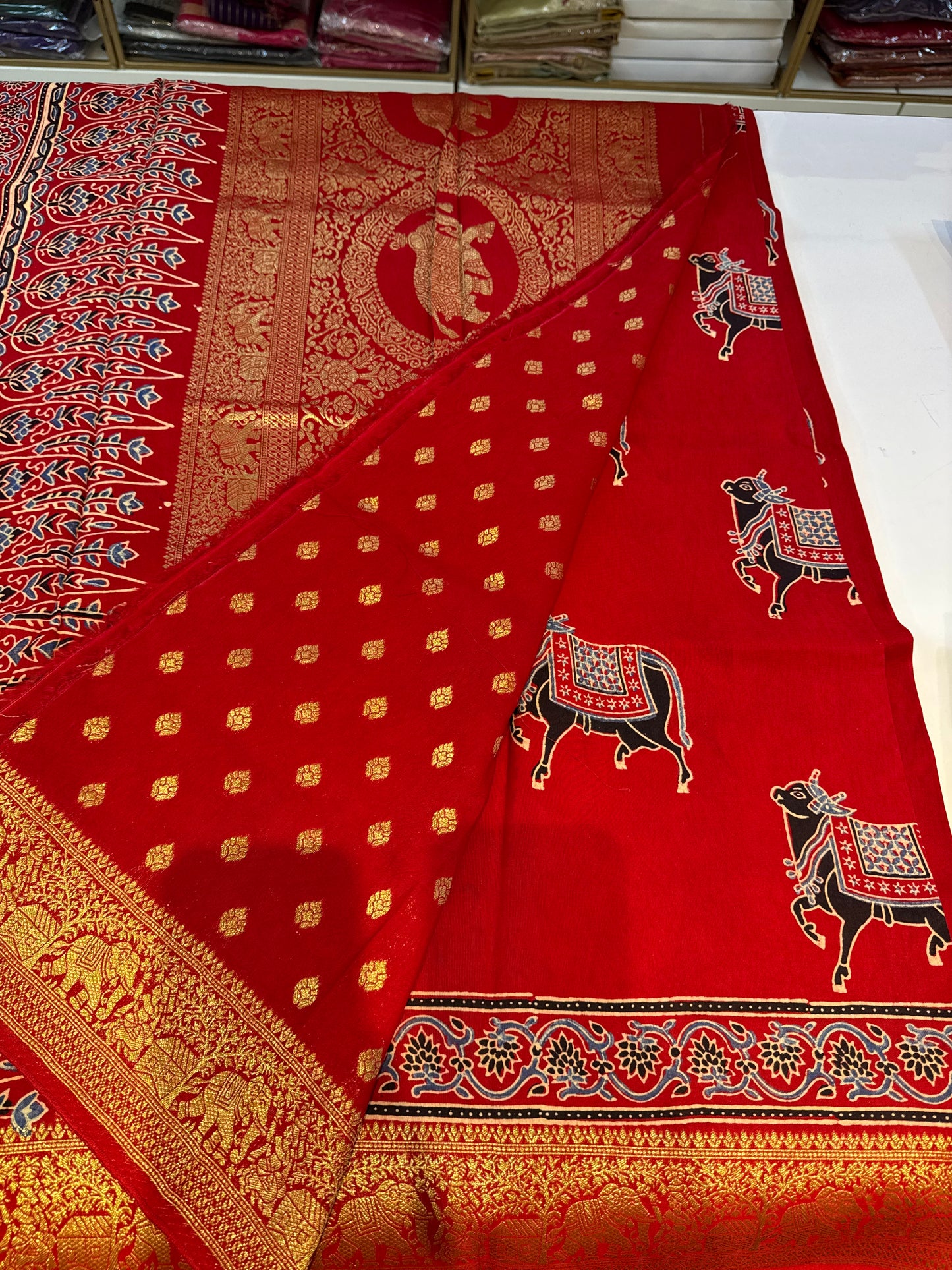 Cow design red Dola Silk Saree with ajrakh hand block print