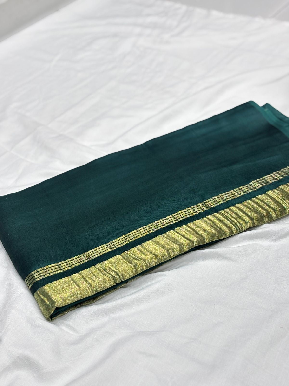 Green pure plain modal silk saree with lagadi pallu