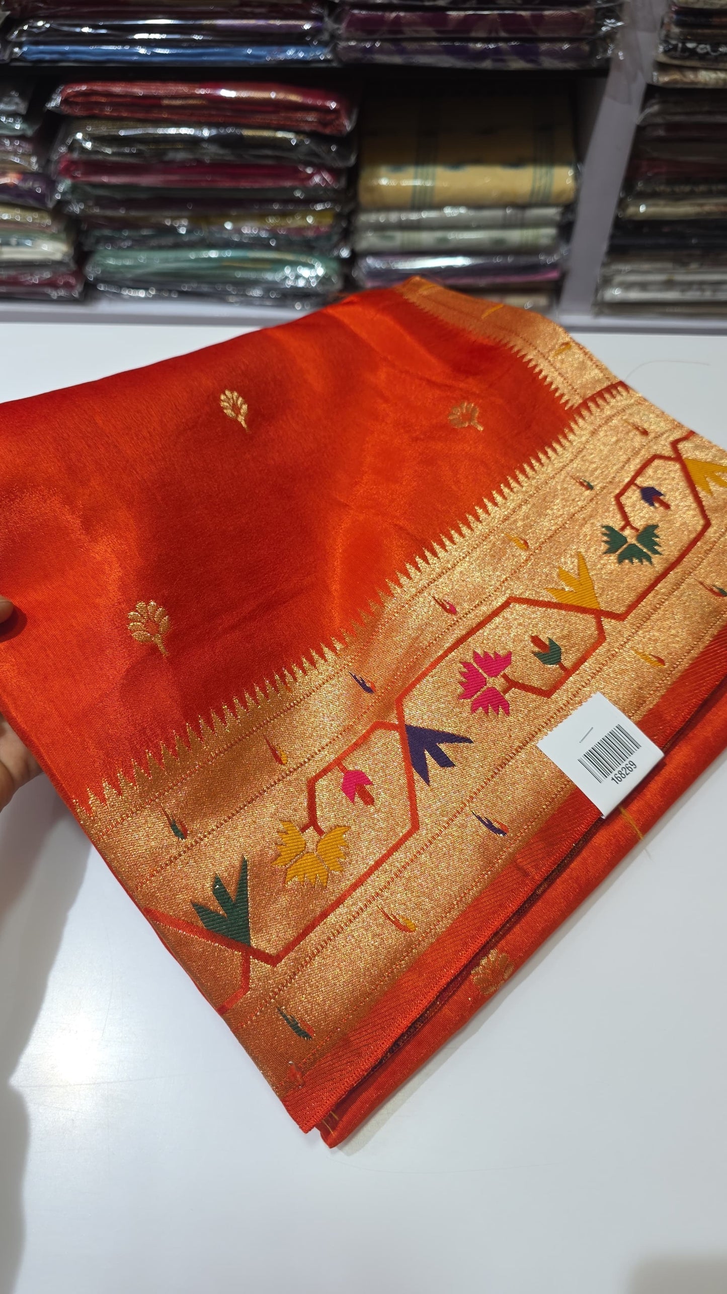Orange dola silk saree with paithani border.