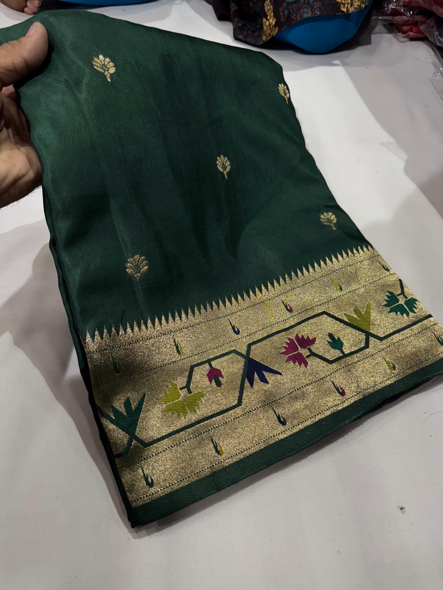 Green dola silk saree with paithani border.