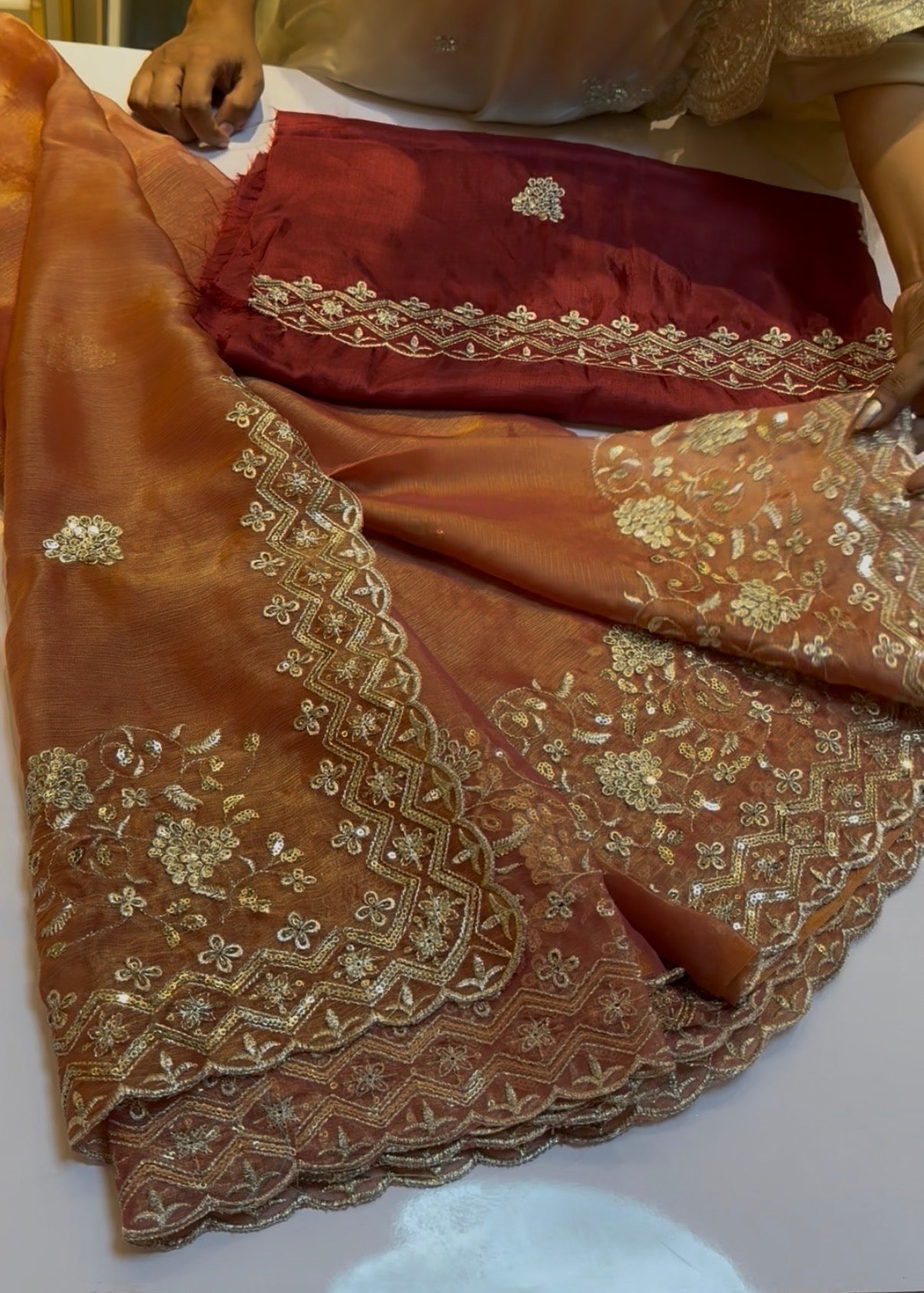 Rust orange fluid organza saree