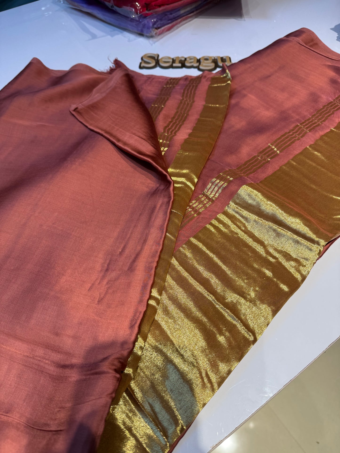Peach pure plain modal silk saree with lagadi pallu
