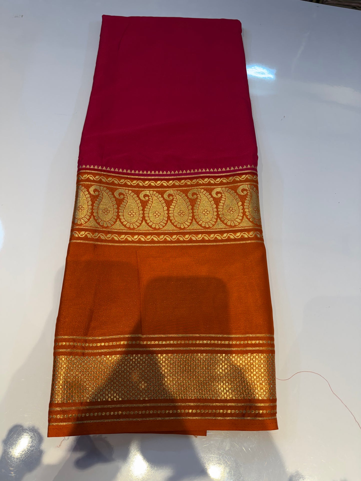 Pink with orange semi crepe mango bentex border saree