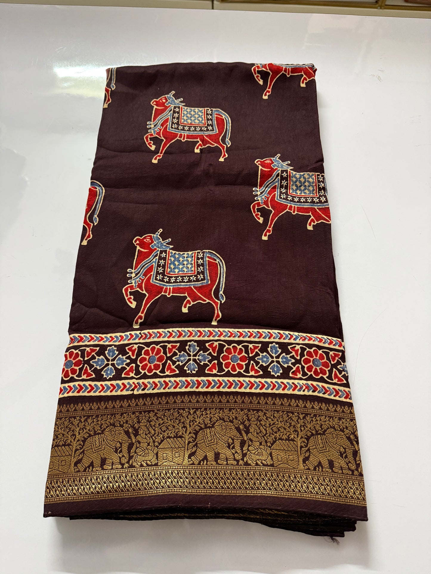 Cow design brown Dola Silk Saree with ajrakh hand block print
