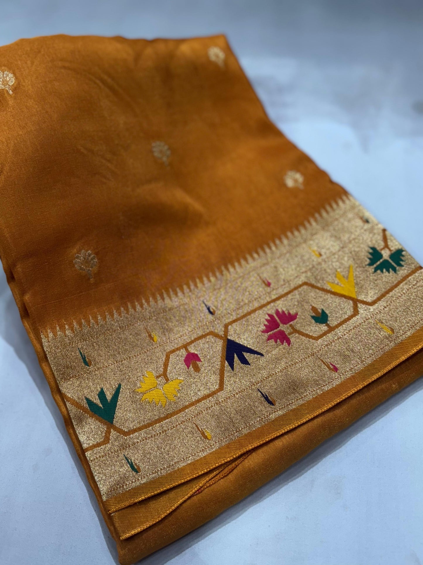 Mustard yellow dola silk saree with paithani border.
