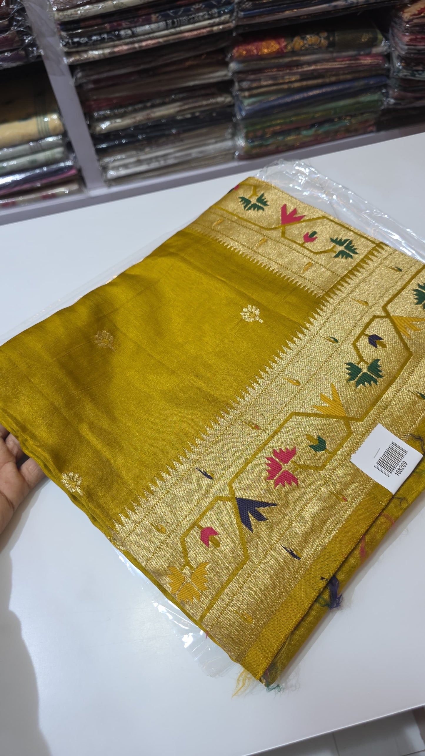 Dola silk saree with paithani border.