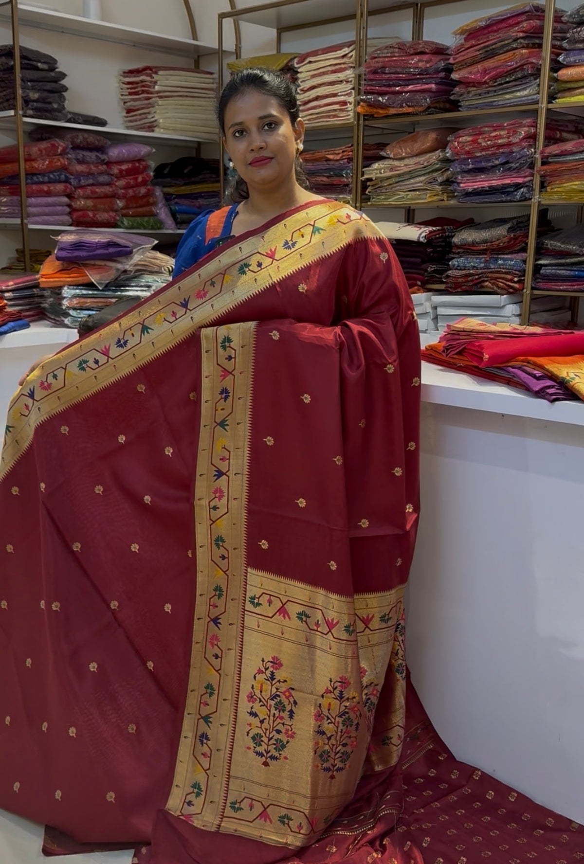 Maroon dola silk saree with paithani border.