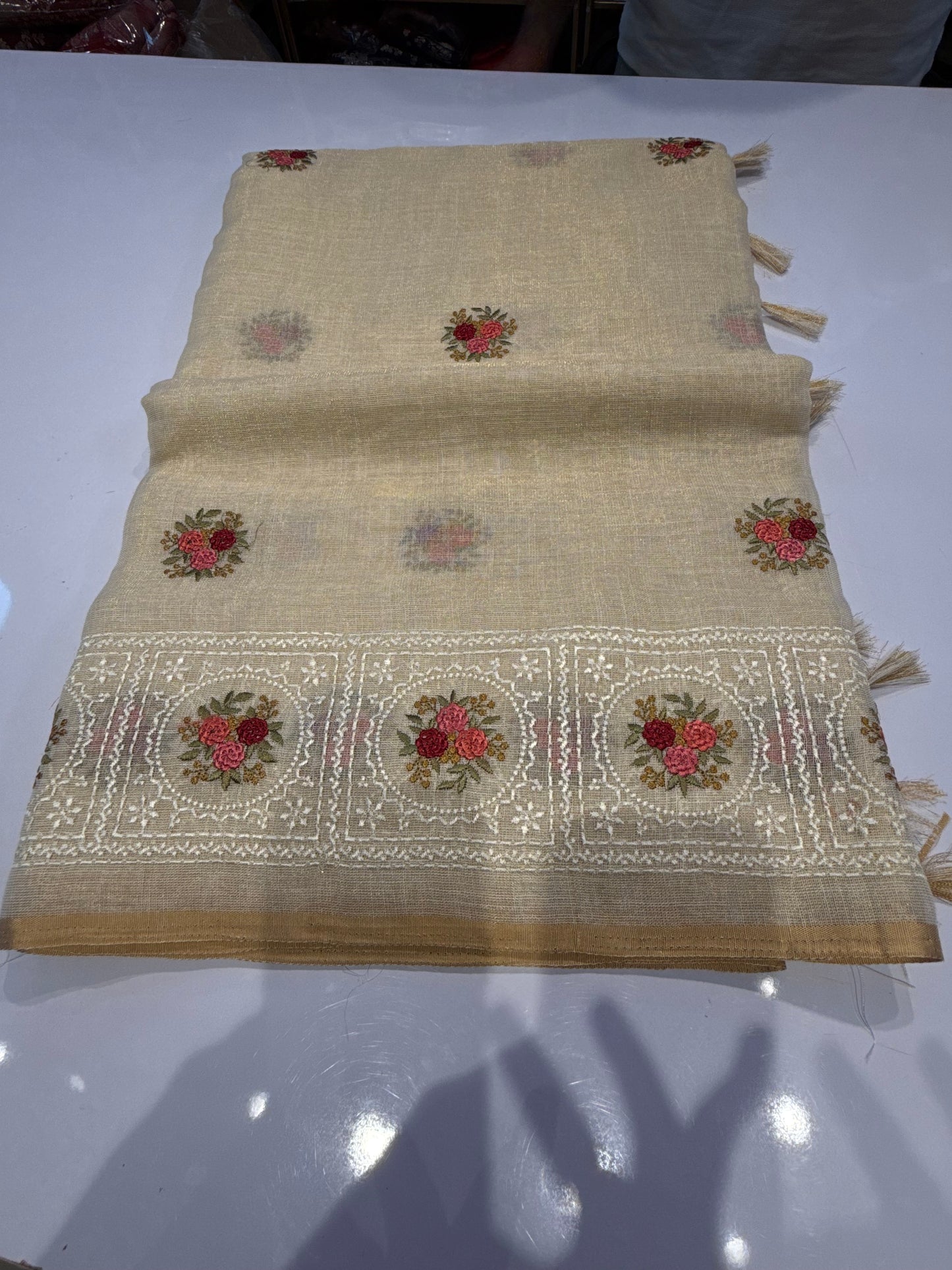 Premium Tissue Linen Saree featuring elegant floral Persian embroidery on the border and pallu, beautifully complemented with intricate traditional Chikankari work. A graceful blend of timeless craftsmanship and understated elegance.
(tissuelinen100)