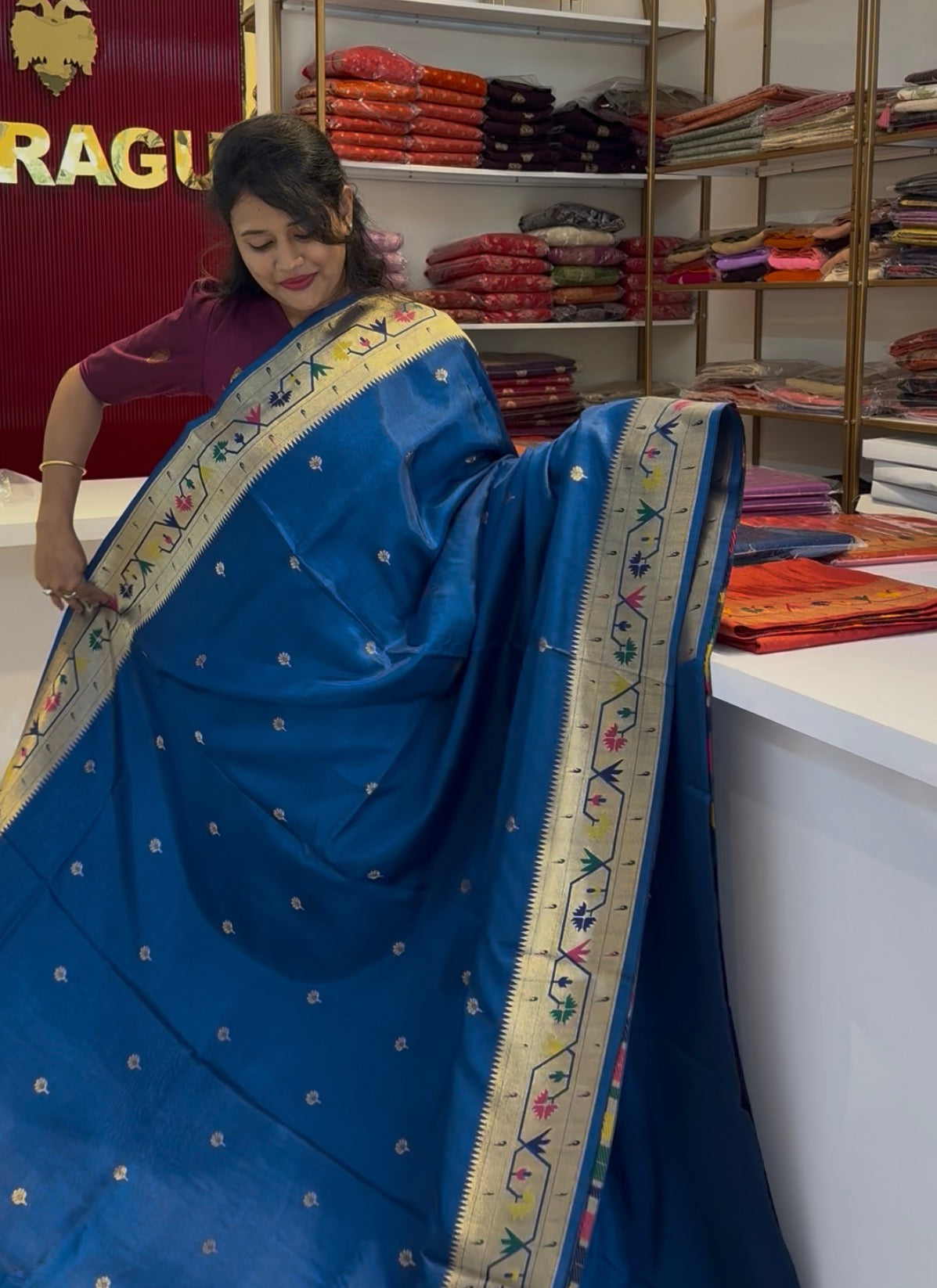 Teal blue dola silk saree with paithani border.