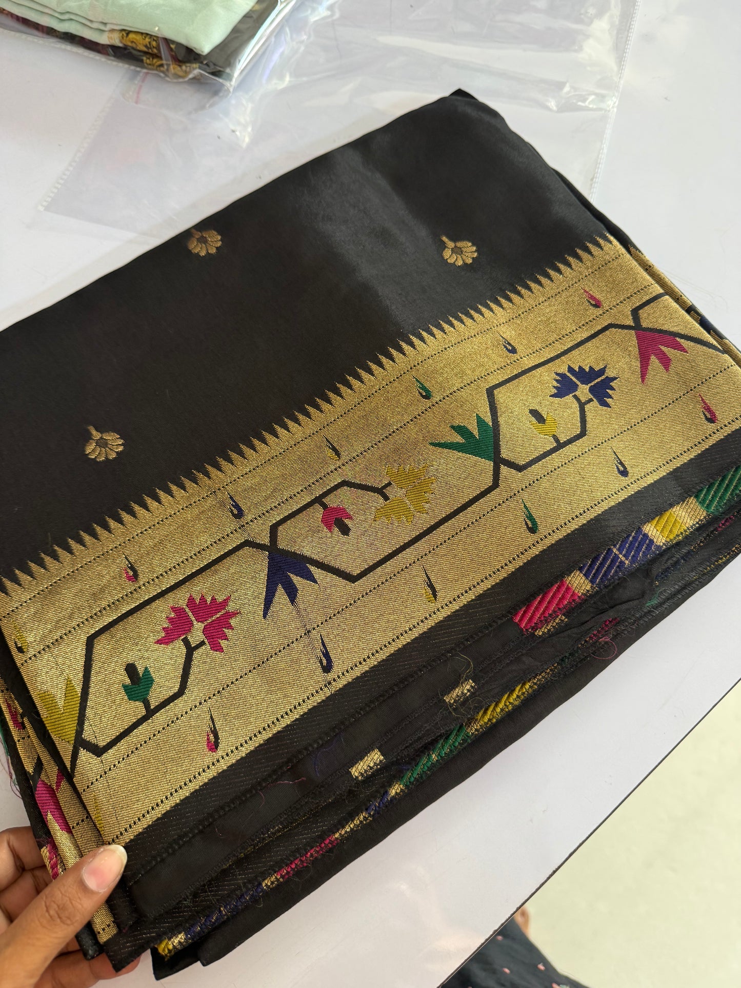 Black dola silk saree with paithani border.